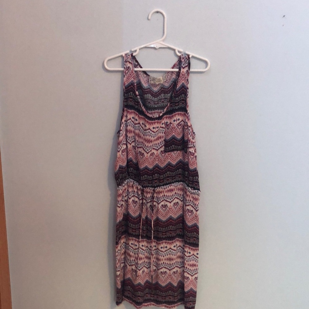 Girls dress with a pocket and a tie in the front